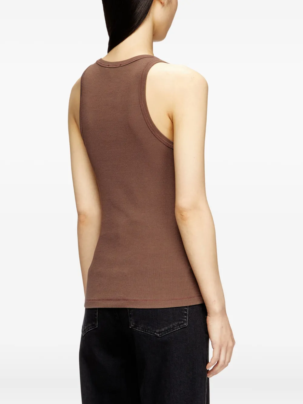 Brown top worn by a person, showing the top fit