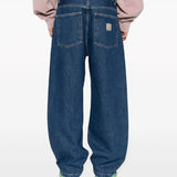 Blue pants worn by a person, showing the pants' fit