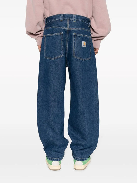 Blue pants worn by a person, showing the pants' fit