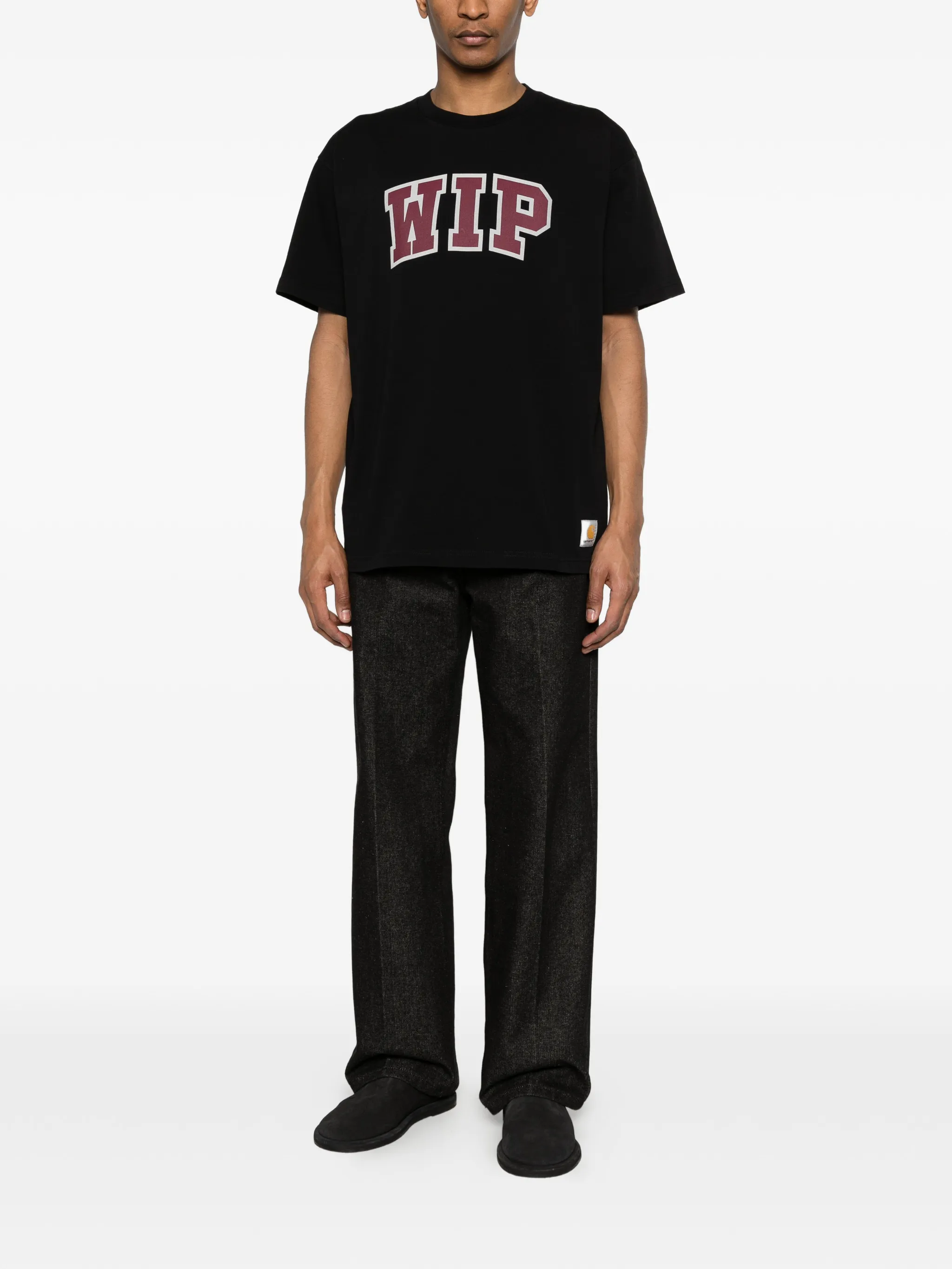 Black t-shirt worn by a person, showing the t-shirt's fit