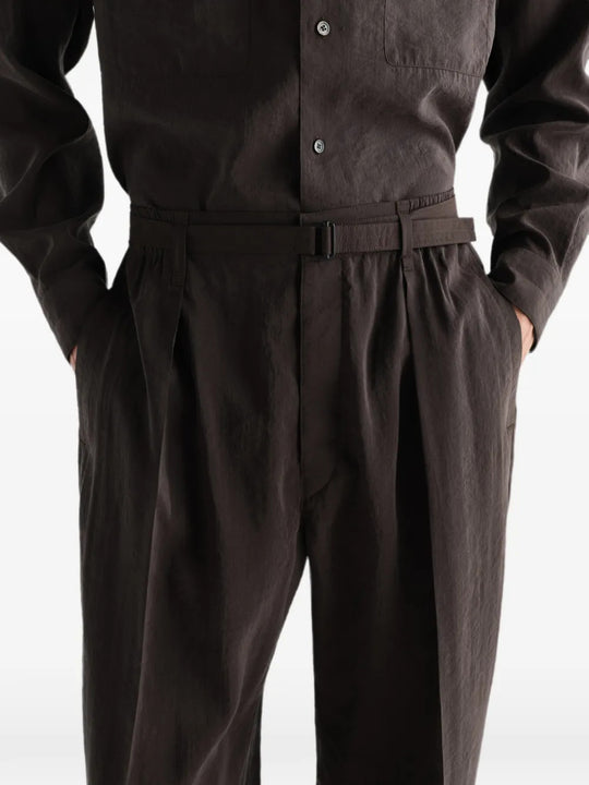 Brown pants worn by a person, showing the pants fit