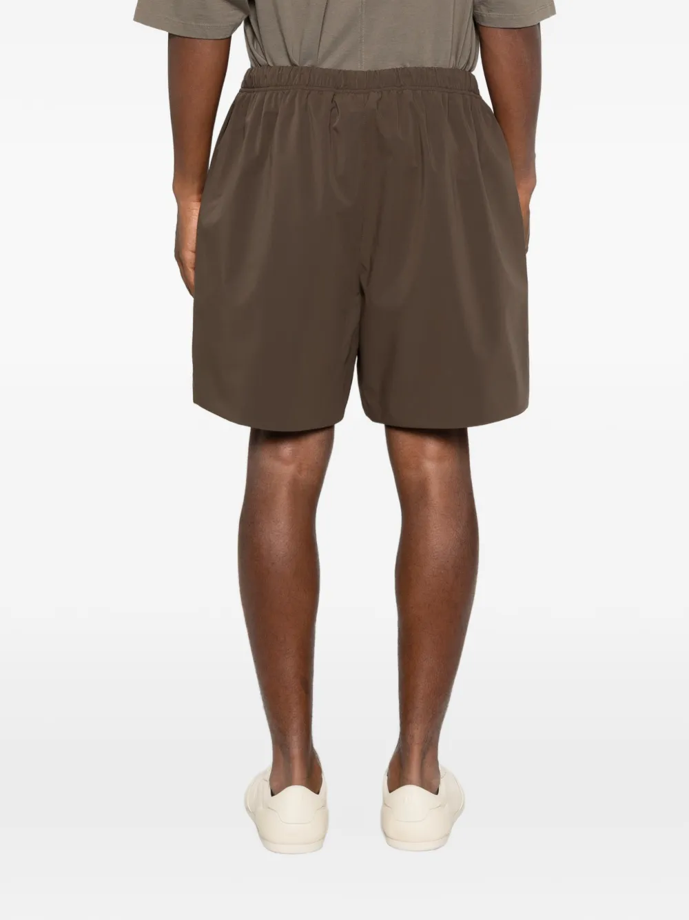 Brown shorts worn by a person,showing the shorts fit