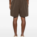 Brown shorts worn by a person,showing the shorts fit