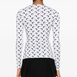 White top worn by a person, showing the top's fit