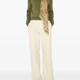 Tan scarf worn by a person, showing the scarf fit