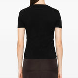 Black shirt worn by a person, showing the shirt fit