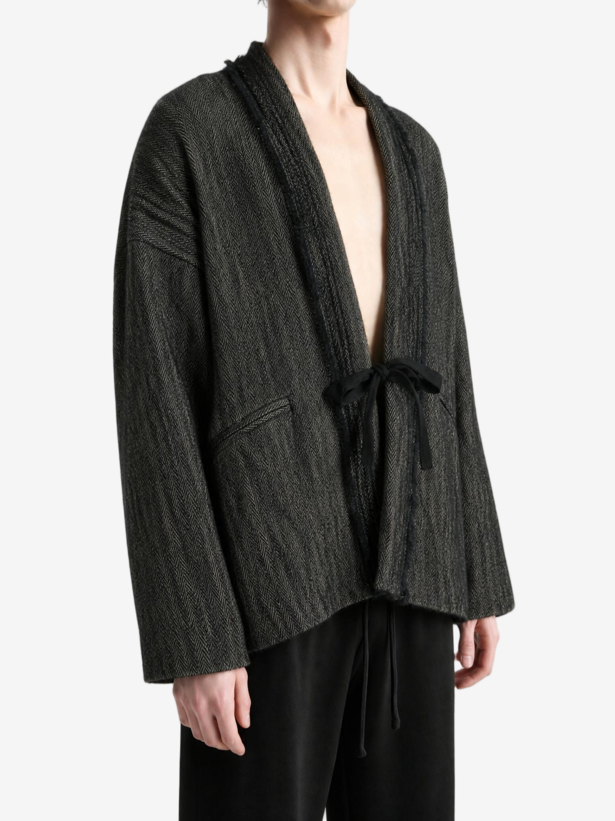 Grey jacket worn by a person, showing the jacket fit