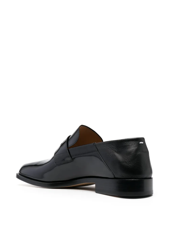 Black loafers,back view