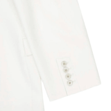 Close up of white jacket, showing texture of the wool fabric