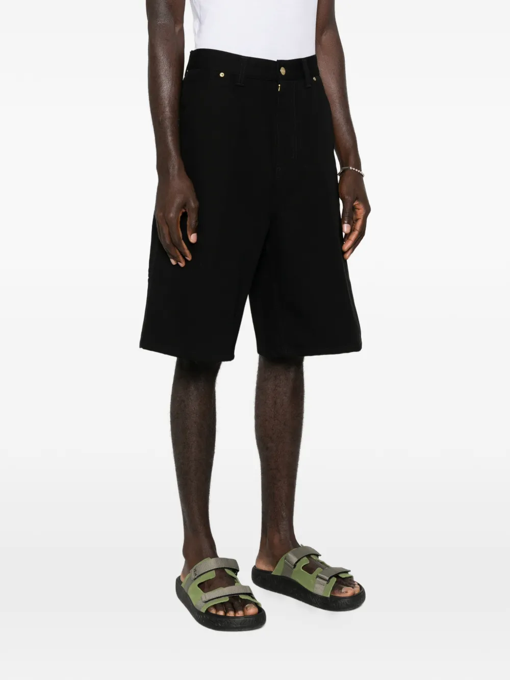 black short worn by a person, showing the short fit