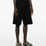 black short worn by a person, showing the short fit