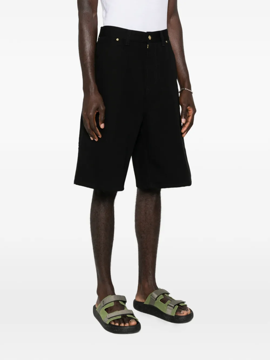 black short worn by a person, showing the short fit