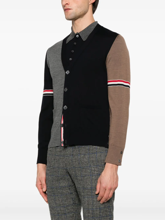 Blue knitwear worn by a person, showing the knitwear's fit