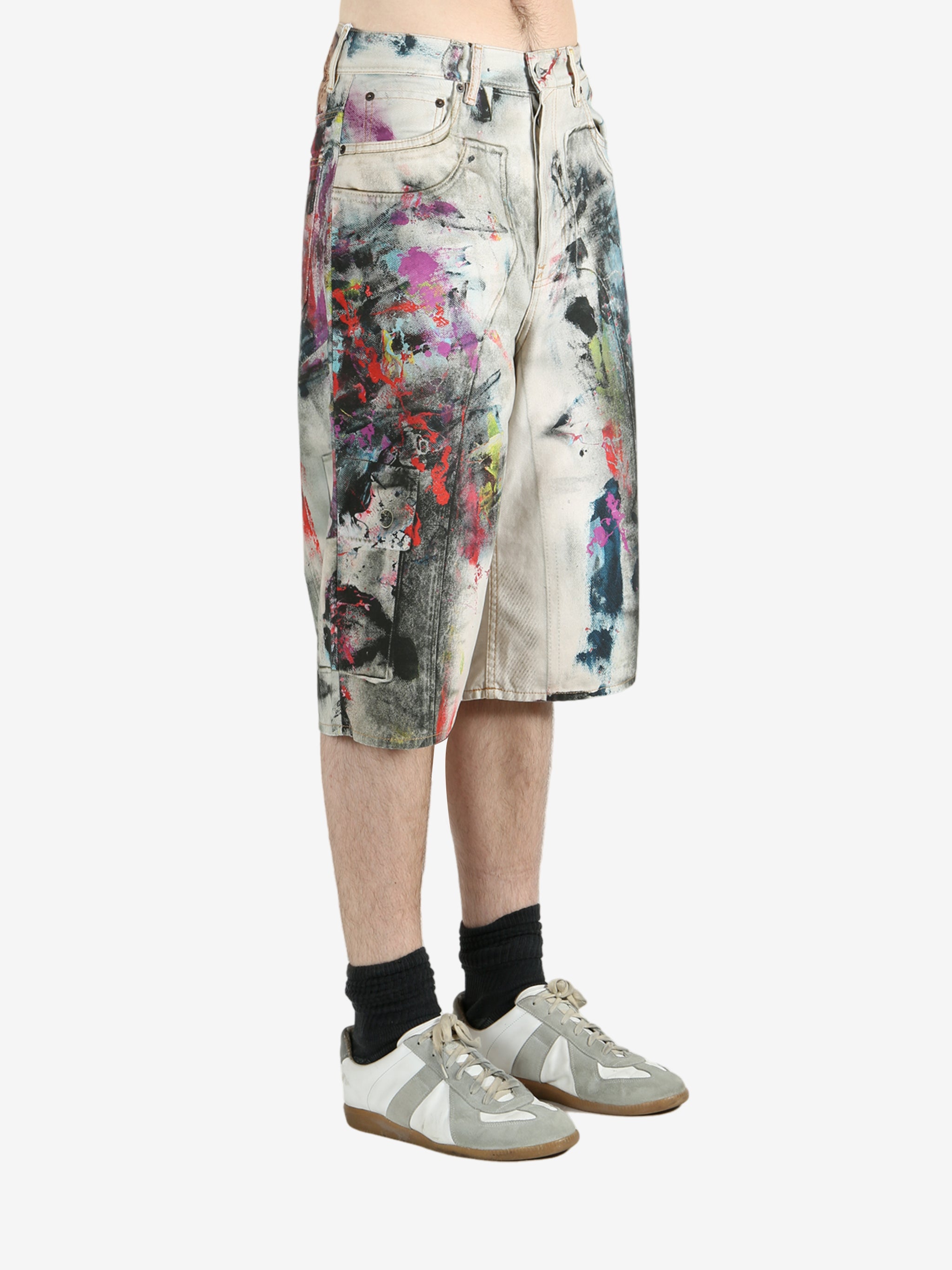 White shorts worn by a person, showing the shorts's fit