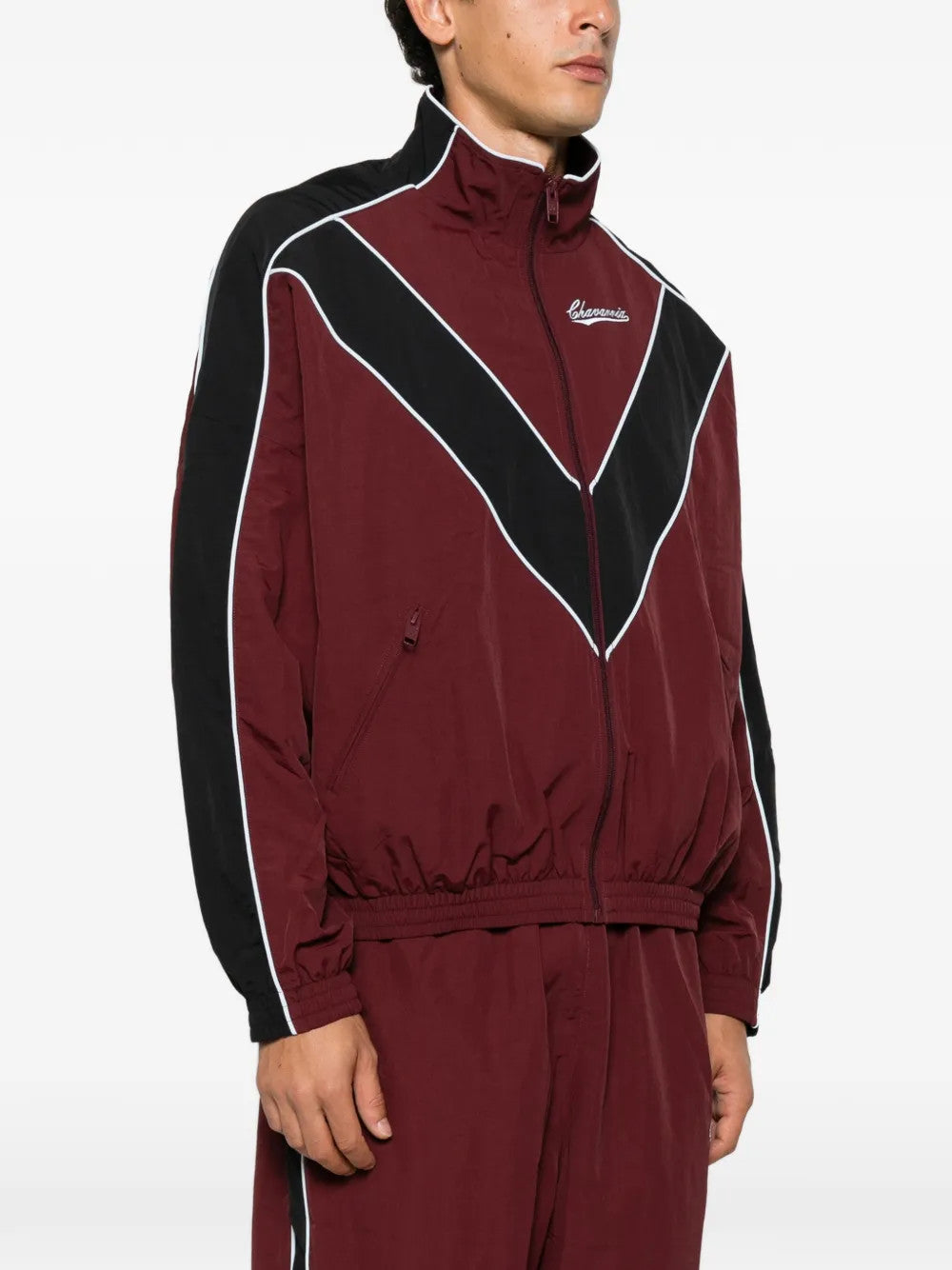 Burgundy jacket worn by a person, showing the jacket fit