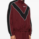 Burgundy jacket worn by a person, showing the jacket fit