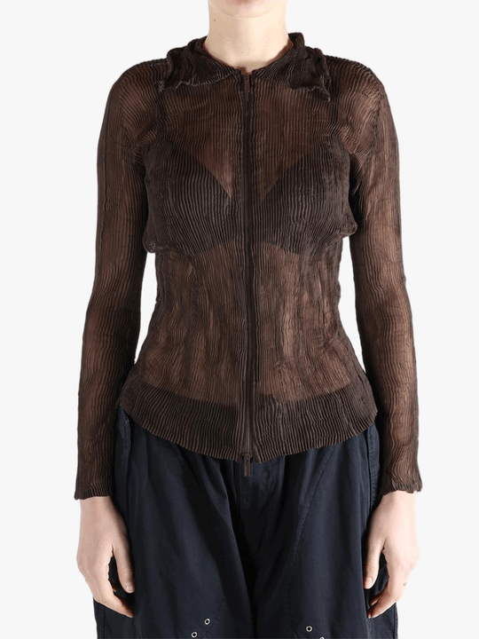 Brown shirt worn by a person, showing the shirt fit