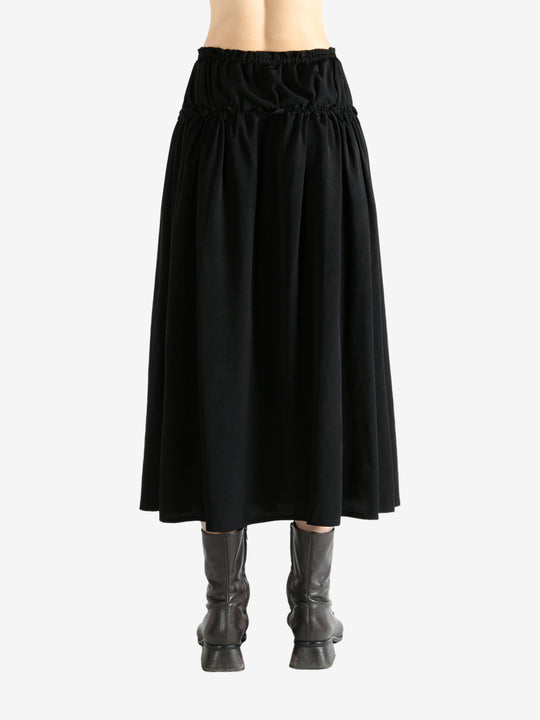 Black skirt worn by a person, showing the skirt fit