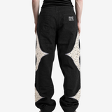 Black pants worn by a person, showing the pants fit