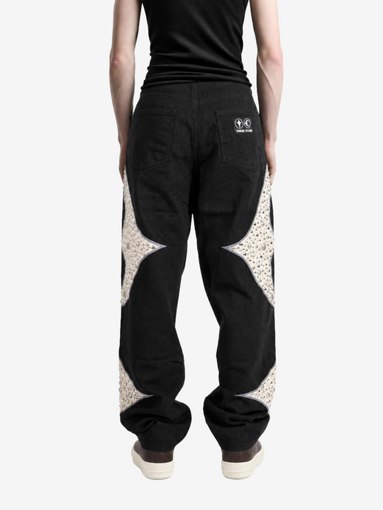 Black pants worn by a person, showing the pants fit