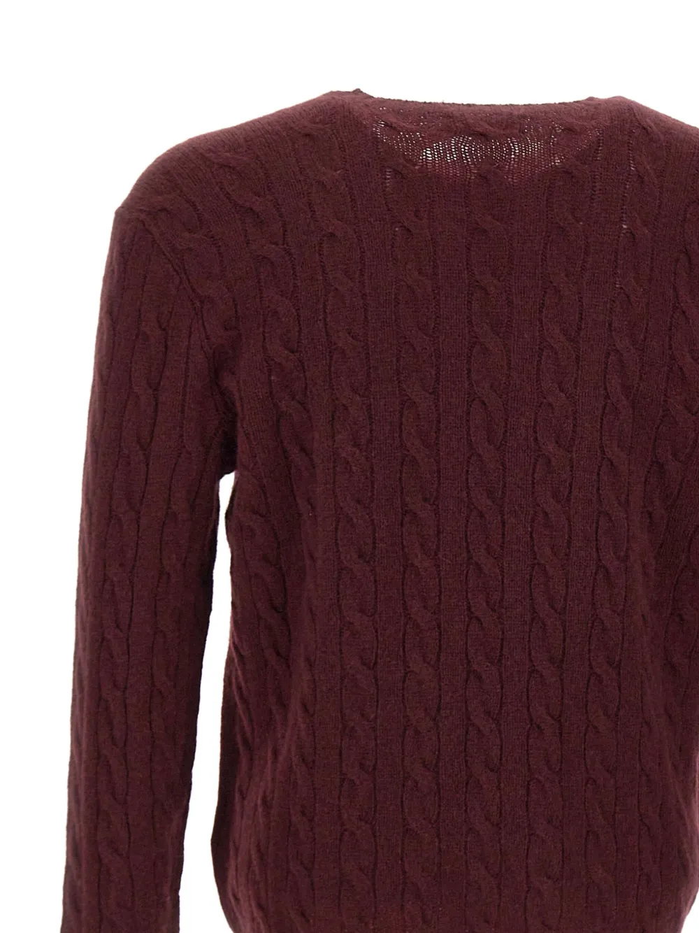 Close up of red knitwear, showing texture of the wool fabric