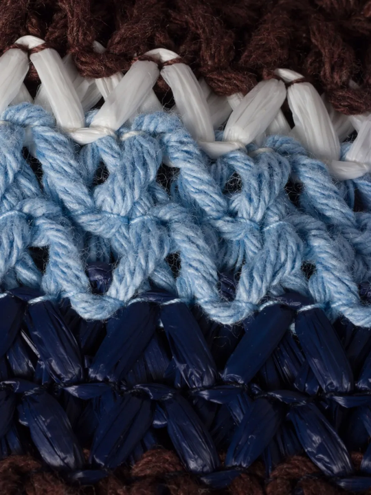 Close up of brown bag, showing the material of cotton