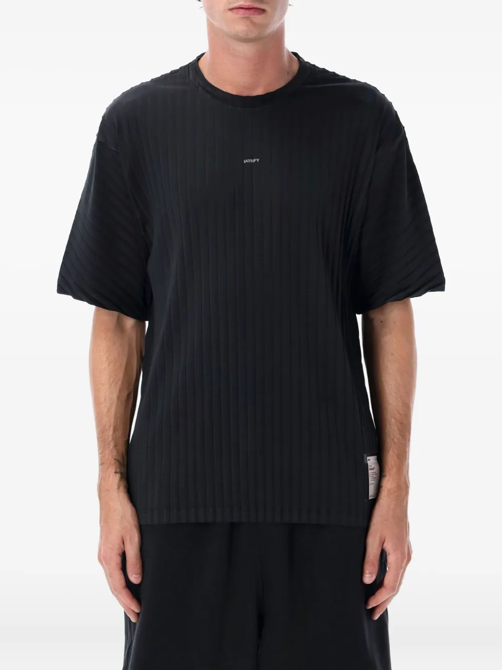 Black t-shirt worn by a person, showing the shirt's fit