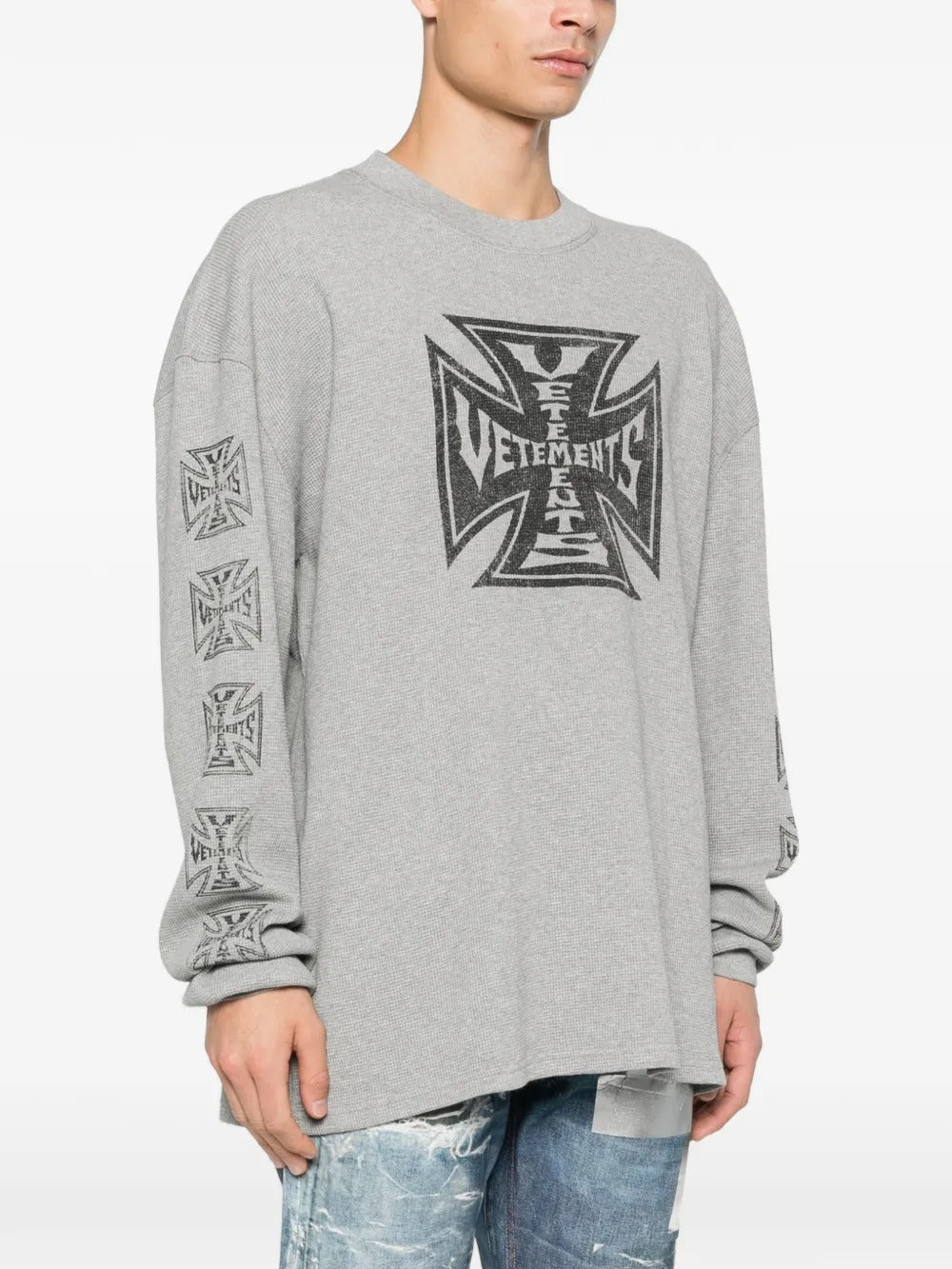 Grey sweats worn by a person, showing the sweats' fit