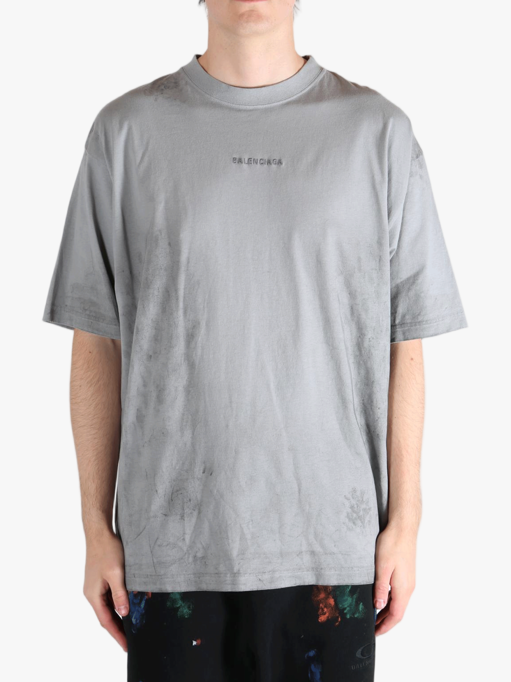 Grey t-shirt worn by a person, showing the t-shirt's fit