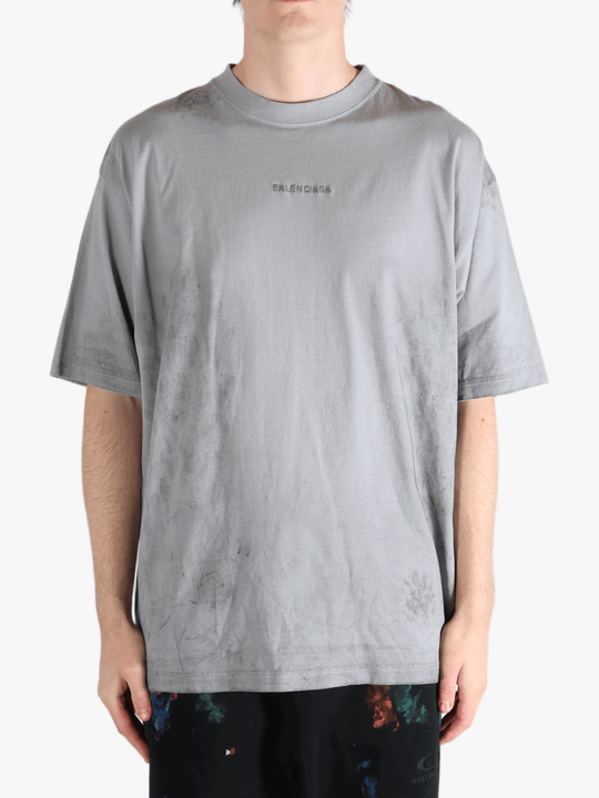 Grey t-shirt worn by a person, showing the t-shirt's fit