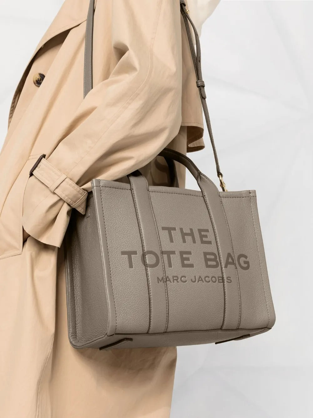 Grey bag carried by a person, showing the bag's size