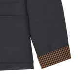 Close up of Grey shirt, showing texture of the 100% wool fabric