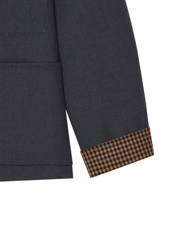 Close up of Grey shirt, showing texture of the 100% wool fabric