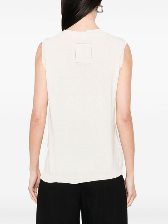 Unknown top worn by a person, showing the top fit
