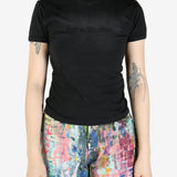 Black T-shirt worn by a person, showing the shirt's fit