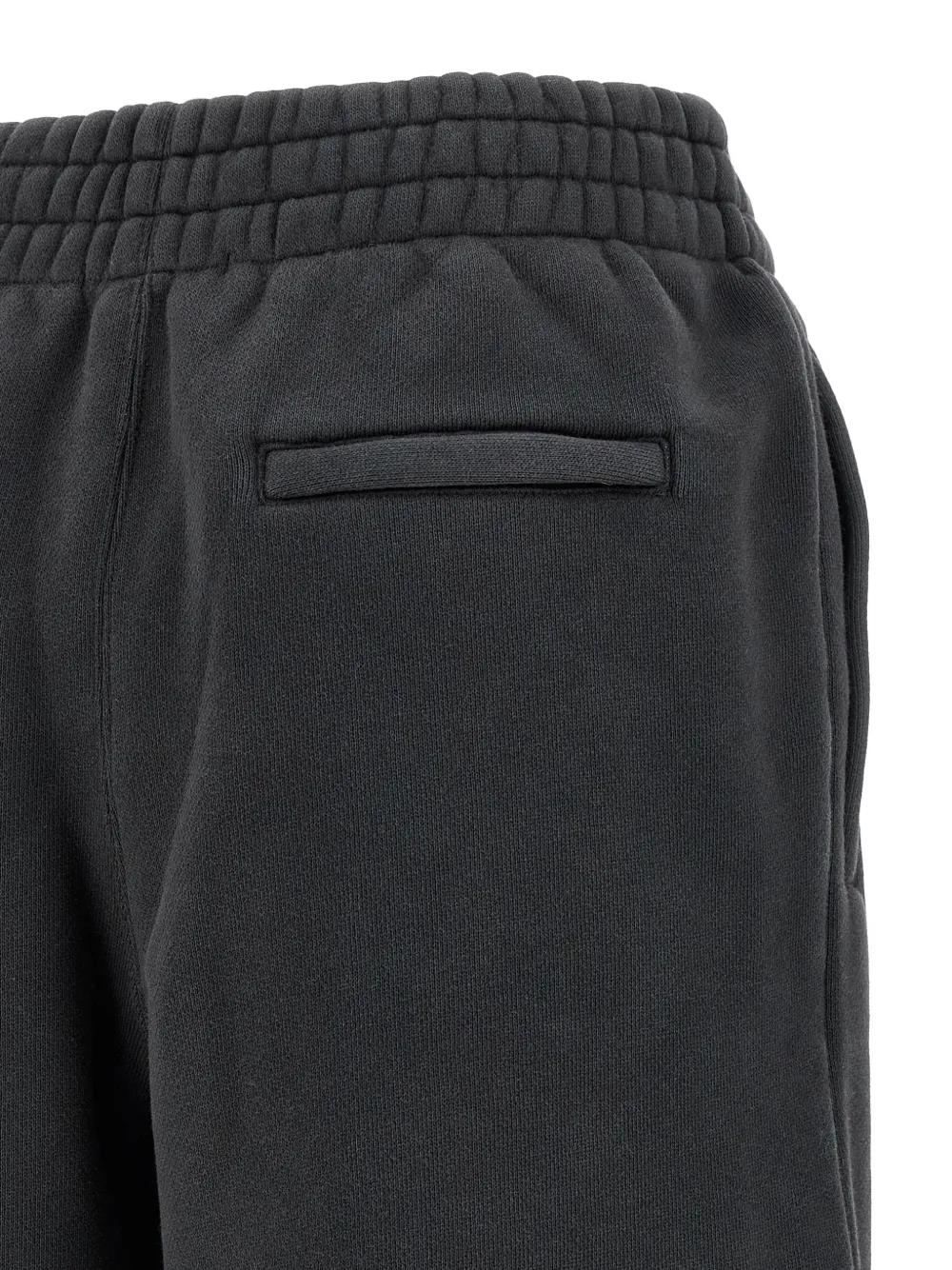 Close up of black pants, showing texture of the cotton fabric