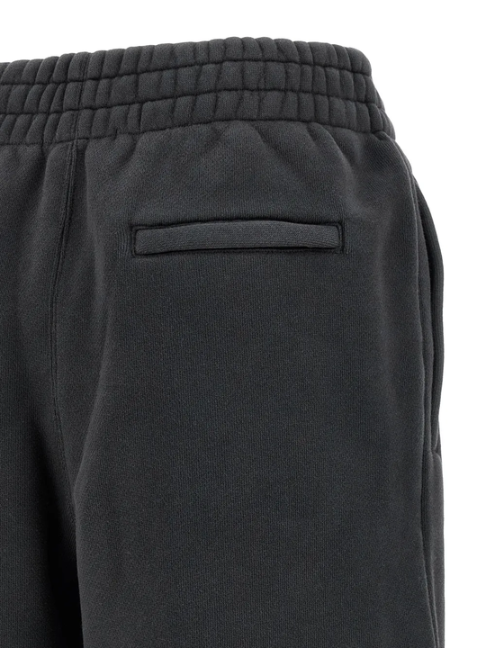 Close up of black pants, showing texture of the cotton fabric