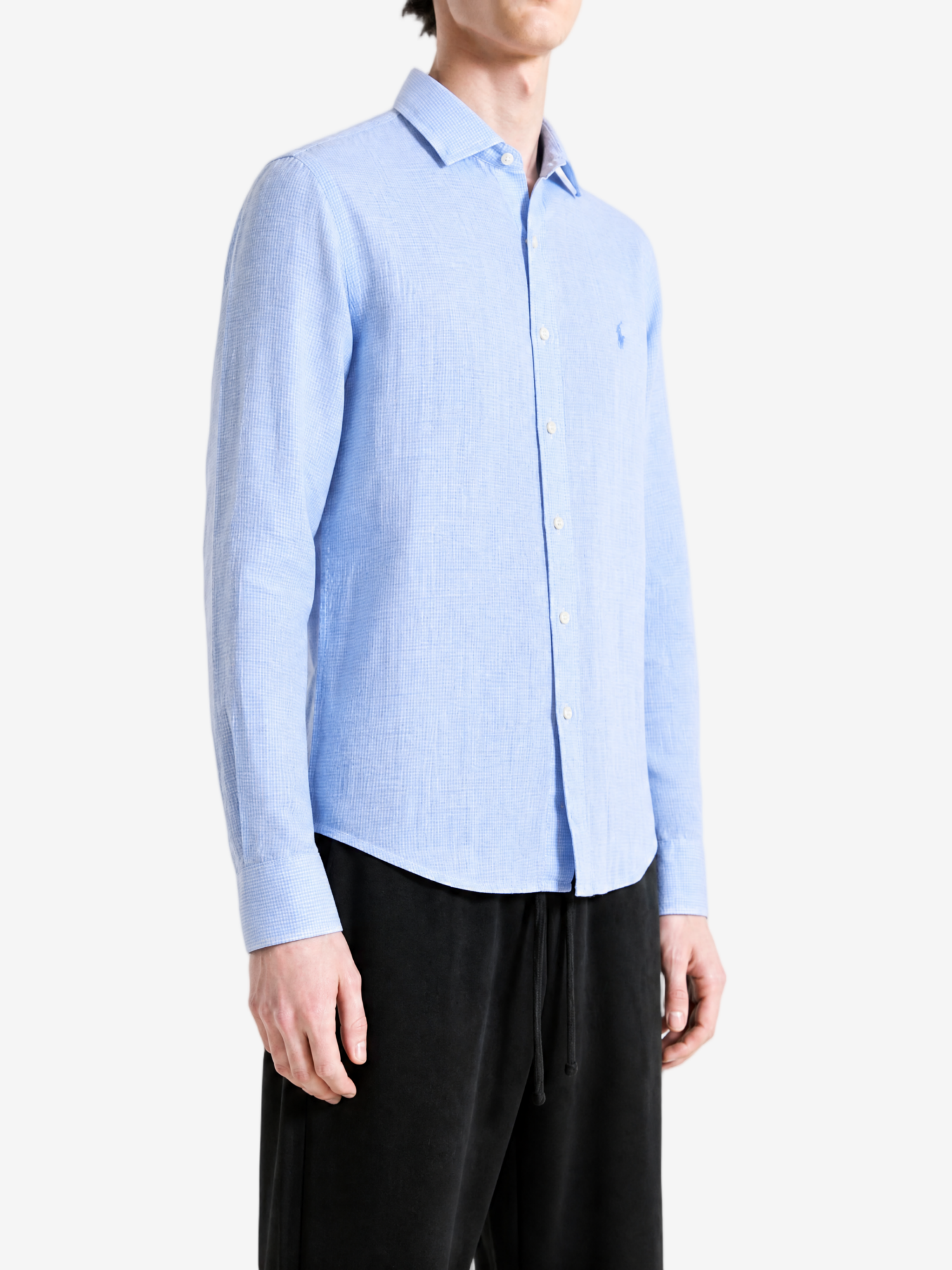 Blue shirt worn by a person, showing the shirt fit