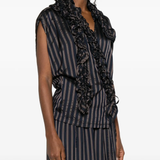 black shirts worn by a person, showing the shirts fit