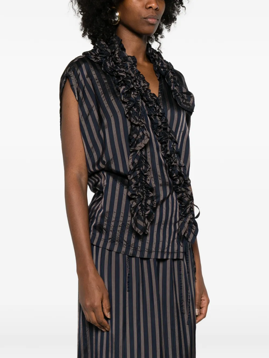 black shirts worn by a person, showing the shirts fit