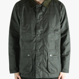 Green jacket worn by a person, showing the jacket's fit