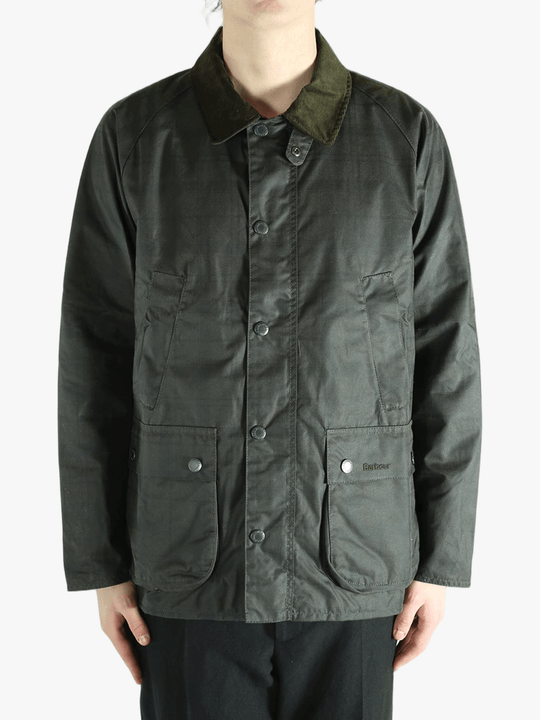 Green jacket worn by a person, showing the jacket's fit