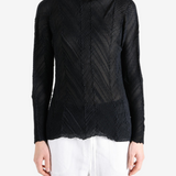 Black shirt worn by a person, showing the shirt fit