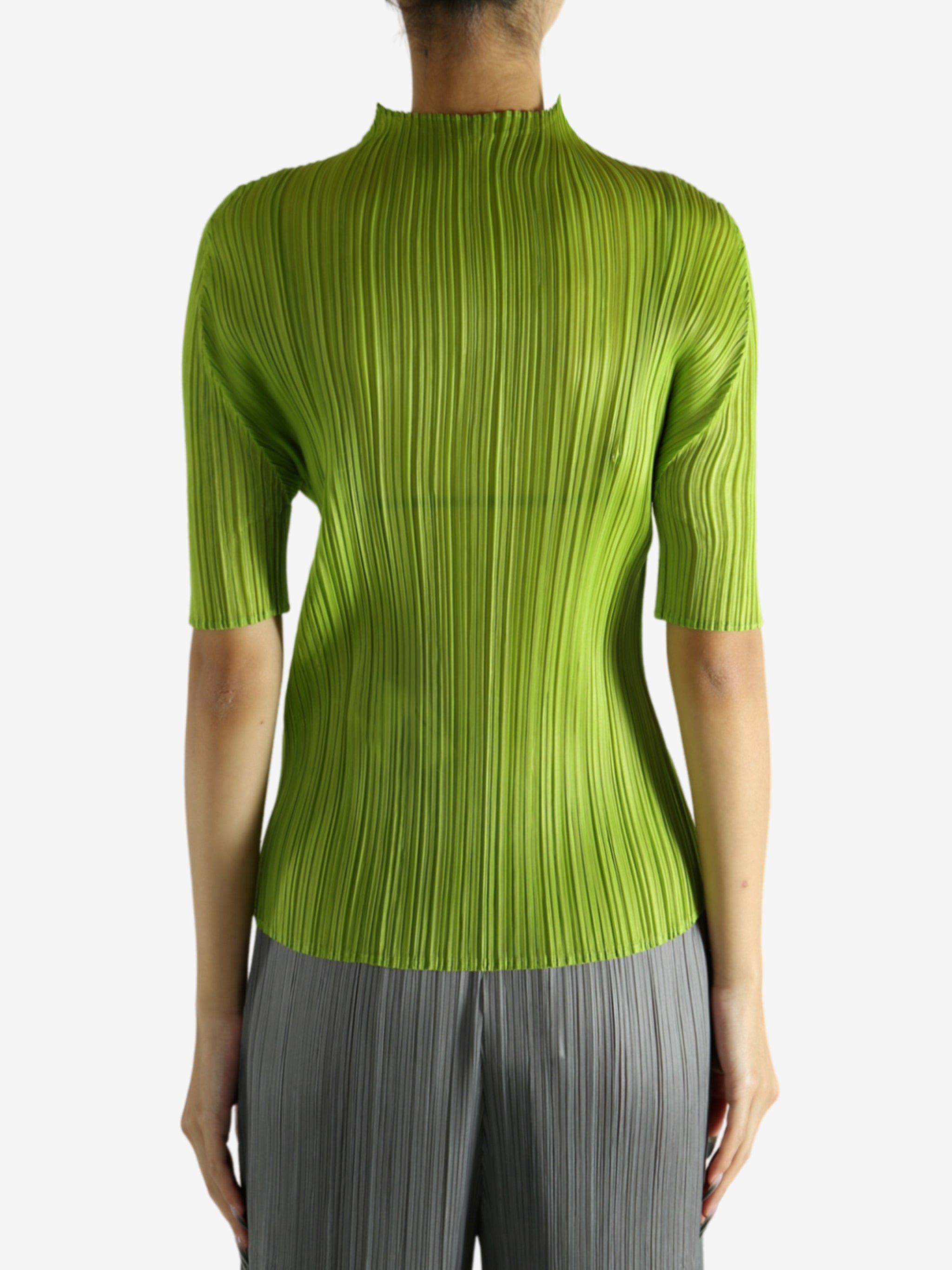 Green shirt worn by a person, showing the shirt's fit