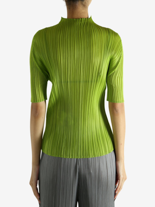 Green shirt worn by a person, showing the shirt's fit