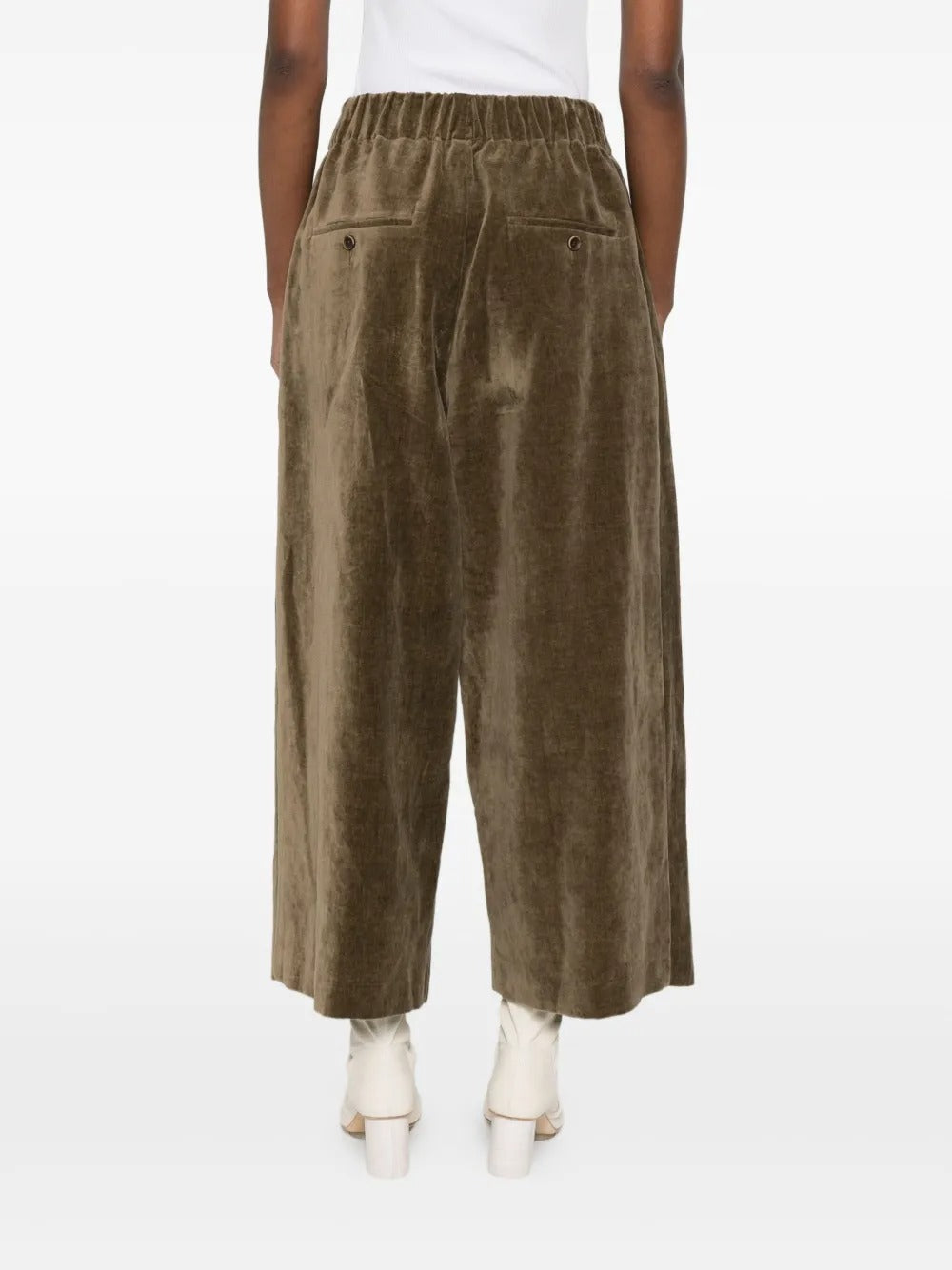 Brown pant worn by a person, showing the pant's fit