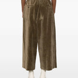 Brown pant worn by a person, showing the pant's fit