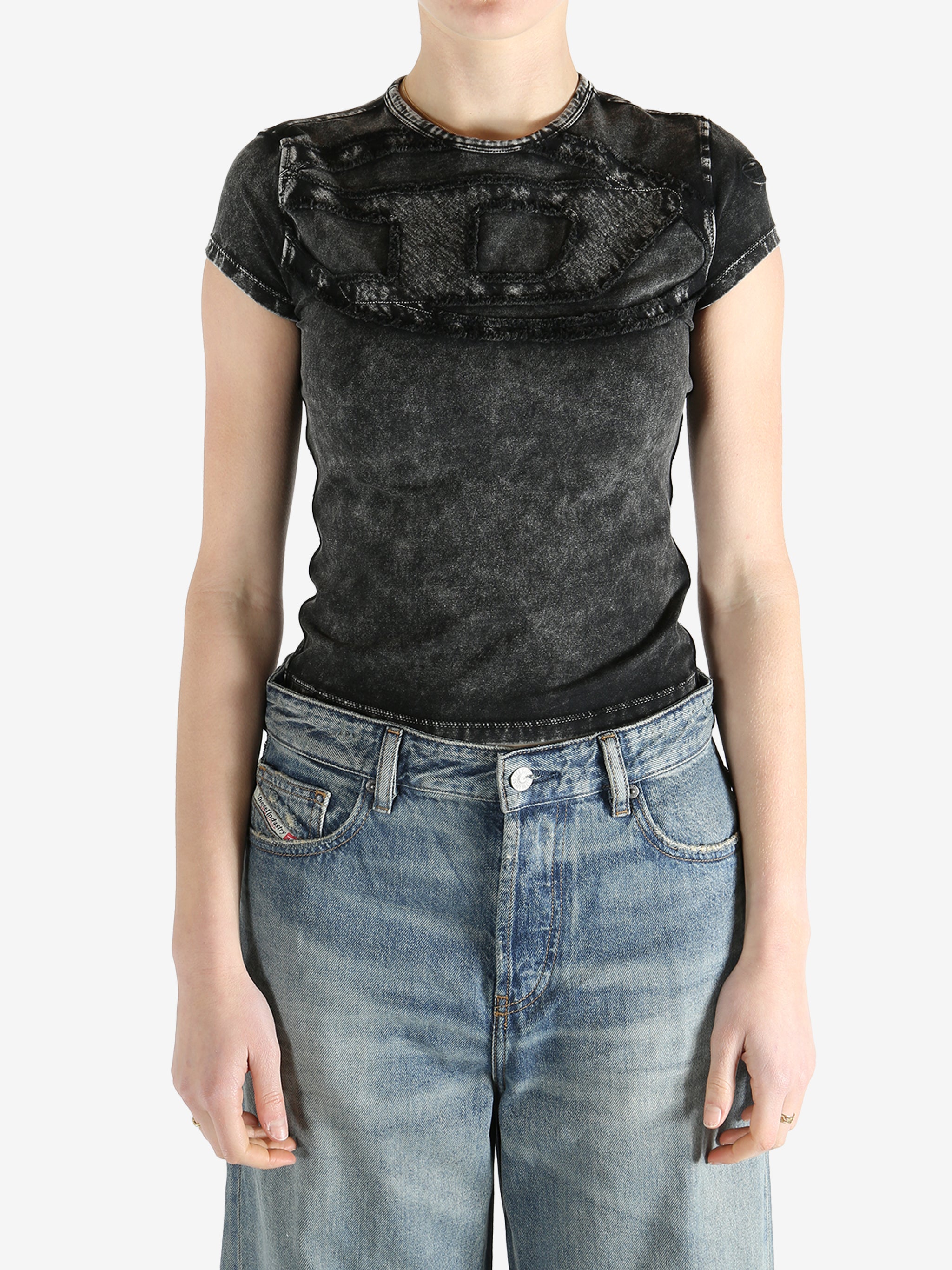 Black top worn by a person, showing the fit