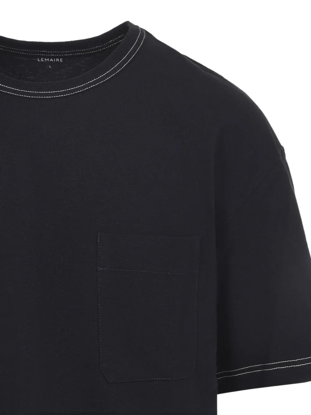 Close up of black t-shirts, showing texture of the cotton fabric