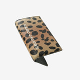 Close up of black wallet, showing texture of the Split Cow Leather fabric